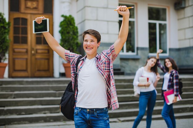 Excited man and female classmates