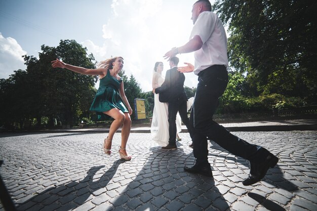 Excited people celebrating wedding