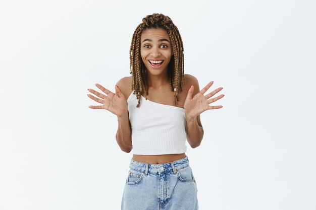 Free photo excited smiling african-american girl rejoicing over big news