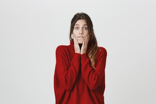 Excited and surprised young woman hear interesting news