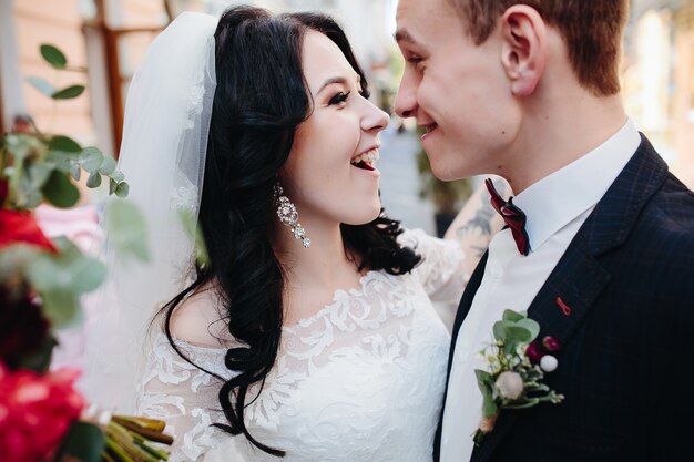 Excited wedding couple looking at each other