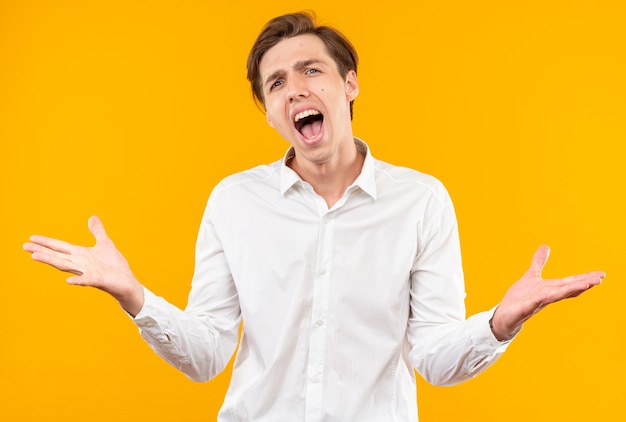 excited with closed eyes young handsome guy wearing white shirt spreading hands isolated on orange wall