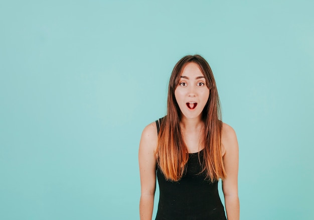 Excited woman looking at camera