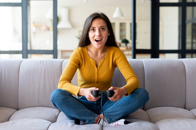 Excited woman playing video games