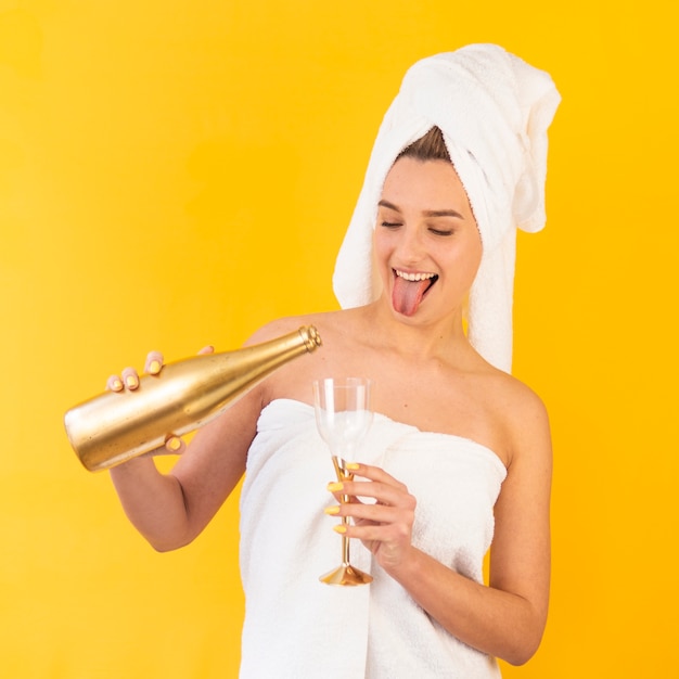 Excited woman pouring drink