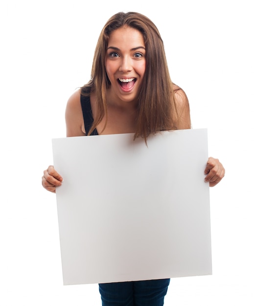 Excited woman showing a blank poster