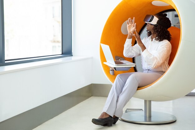 Excited woman testing VR headset