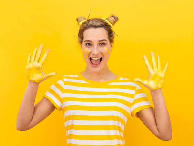 Excited woman with painted hands