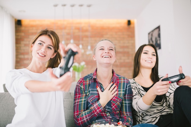 Excited women amused with videogame