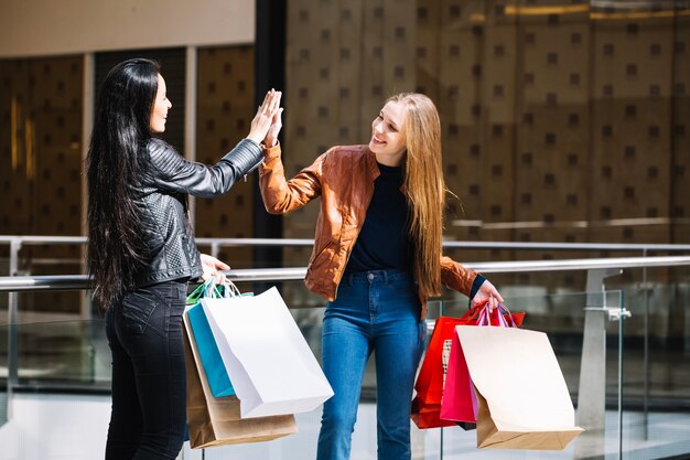 Excited women giving high five