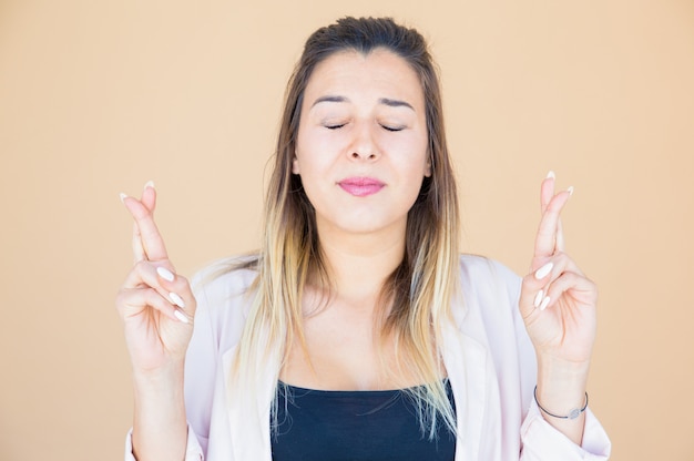 Free photo excited worried lady making wish