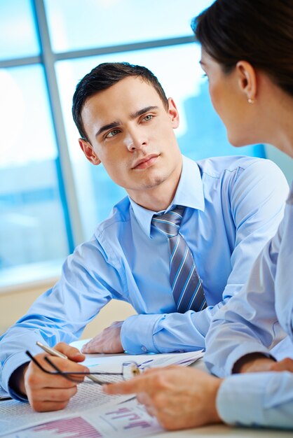 Executive listening to his workmate