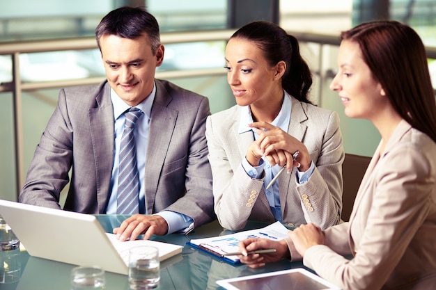 Executives discussing a project at meeting