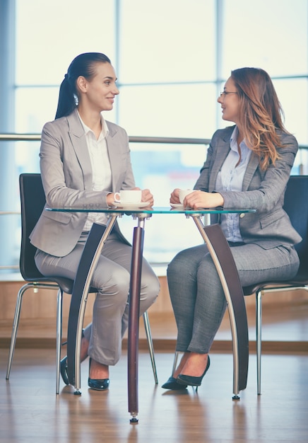 Executives drinking coffee and chatting