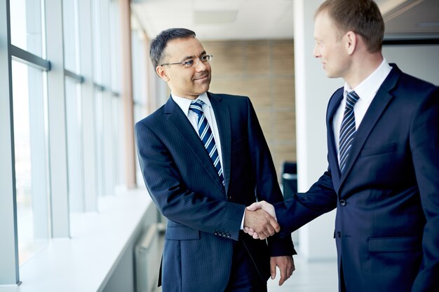 Executives greeting each other