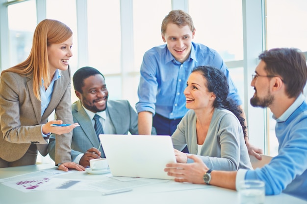 Executives joking and laughing in the office