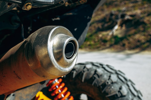 Exhaust pipe of atv car close up