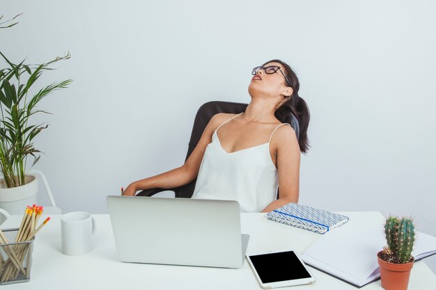 Exhausted businesswoman on her chair