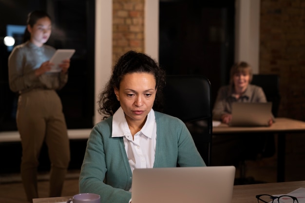 Exhausted people at the office working late