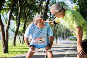 Free photo exhausted senior runner at the park