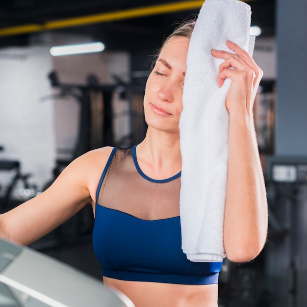 Exhausted woman in gym