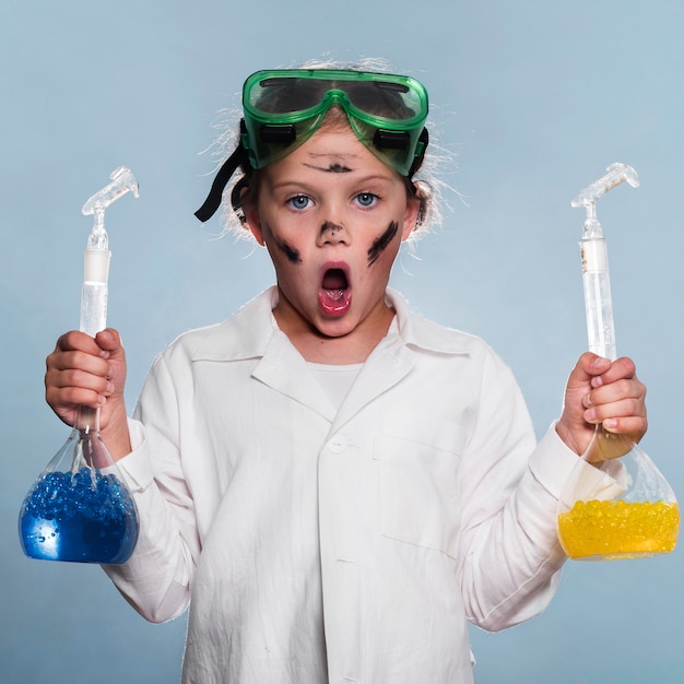 Exited girl with science tubes