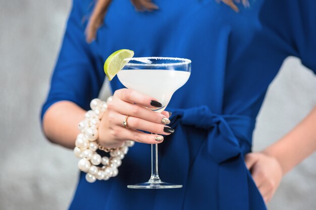 exotic cocktail and female hands
