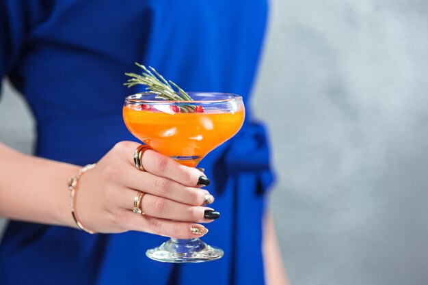 exotic cocktail and female hands