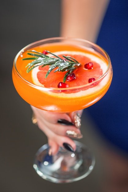 exotic cocktail and female hands