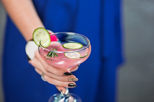 Free photo exotic cocktail and female hands