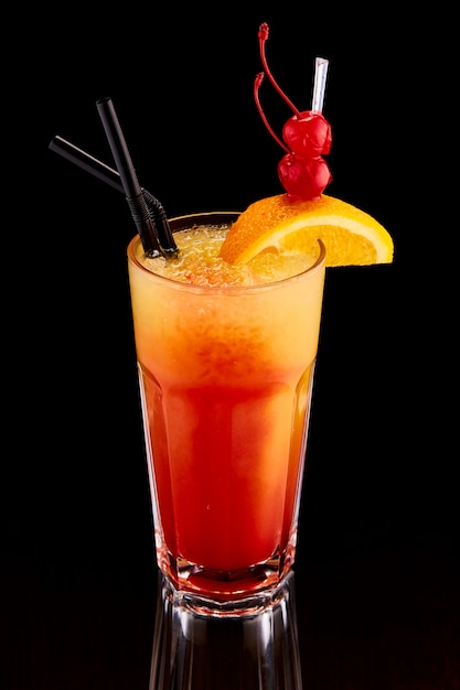 Exotic cocktail with orange and cherry