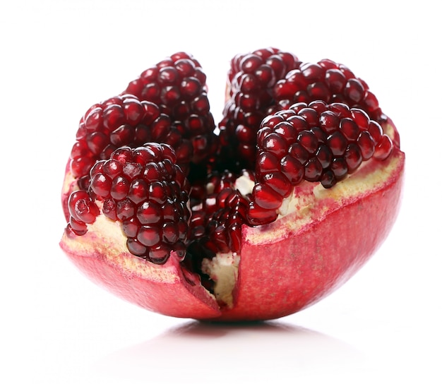 Exotic and delicious pomegranate on white background