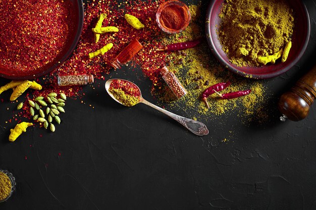 Exotically Spice Mix - spice, herbs, powder top view over dark background. Cooking and spicy food concept. Copy space. Flat lay. Still life