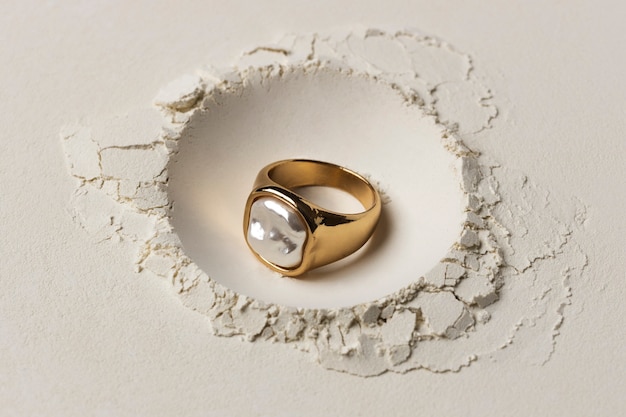 Expensive golden ring with white powder background