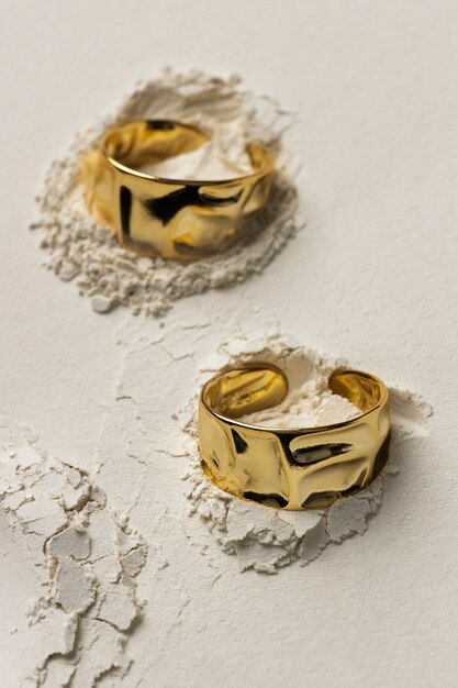 Expensive golden ring with white powder background