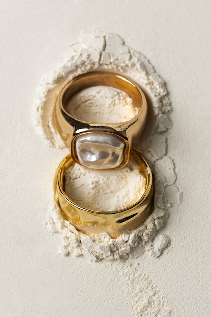 Expensive golden ring with white powder background