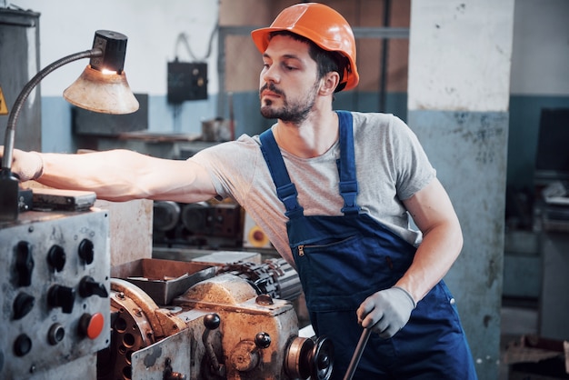 Experienced operator in a hard hat.