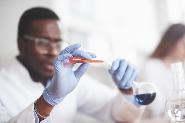 Experiments in the chemical laboratory. an experiment was carried out in a laboratory in transparent flasks.