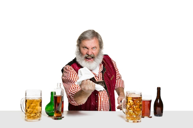 Free photo expert barman with beer at studio