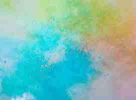 Free photo explosion of colored powder on white background