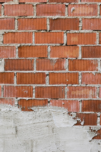 Exposed brick wall with plaster