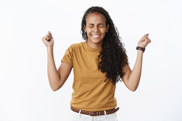 Expressive African-American girl in brown Tshirt