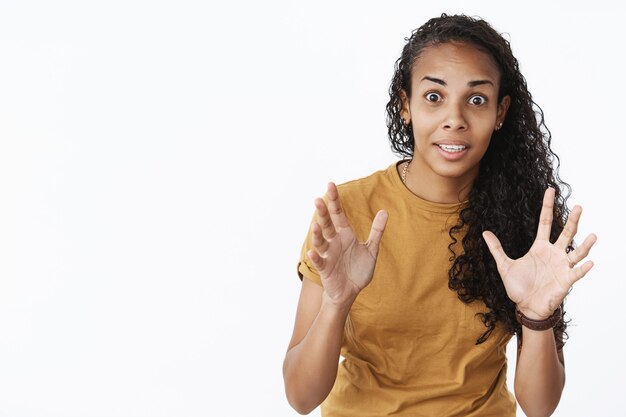 Expressive African-American girl in brown Tshirt