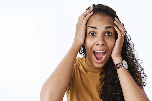 Expressive African-American girl in brown Tshirt