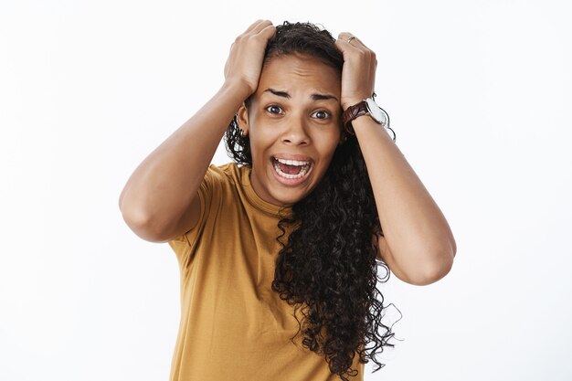 Expressive African-American girl in brown Tshirt