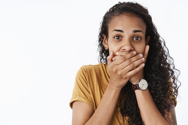 Expressive African-American girl in brown Tshirt