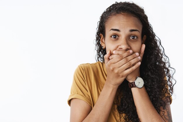 Expressive African-American girl in brown Tshirt