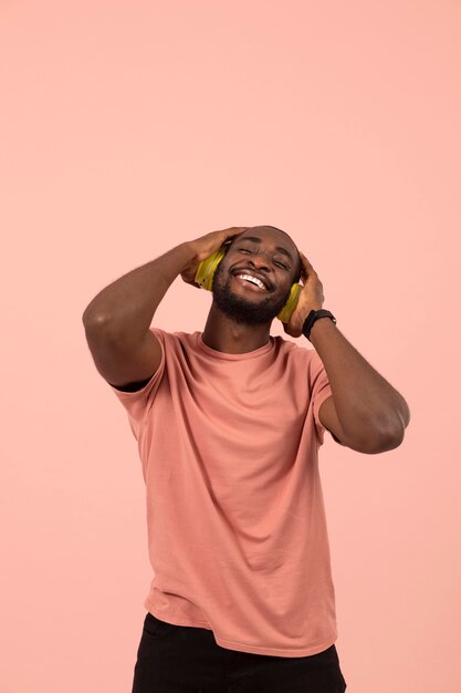 Expressive african american man listening to music