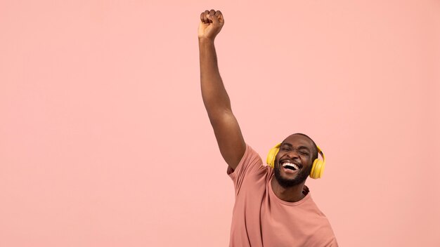 Expressive african american man listening to music