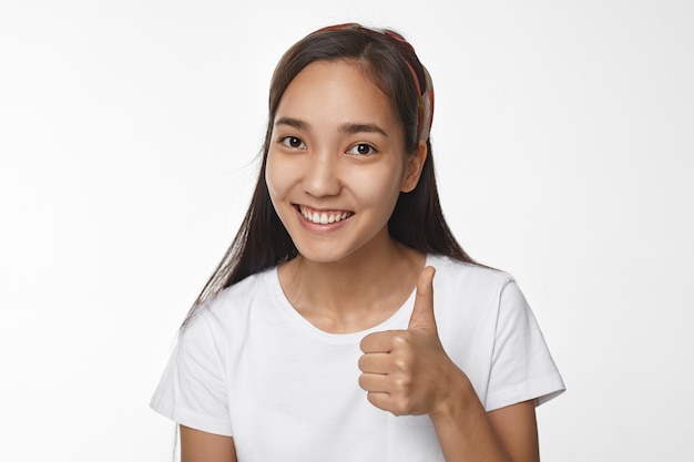 Expressive Asian girl posing indoor